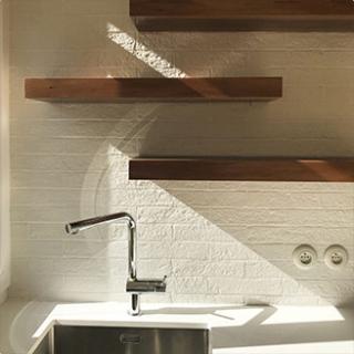 Elegant white kitchen with wood floor , Paris 15