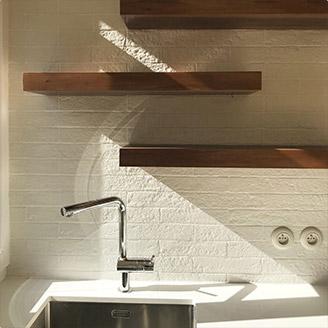 Elegant white kitchen with wood floor , Paris 15