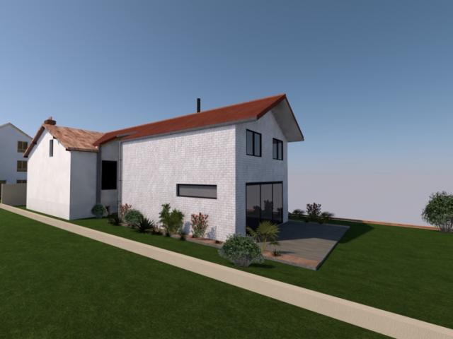 Extension d'une maison de ville en brique et zinc à Villejuif (94)